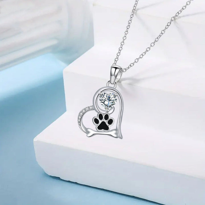 Handcrafted necklace with dog paw print and bone with zirconia